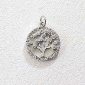 Detailed view of Tree of Life pendant with cubic zirconia inlay and white enamel