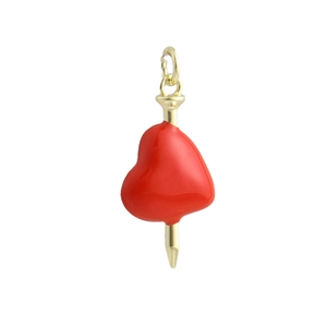 Detail of red enamel heart pendant with a gold-plated nail accent for jewelry making