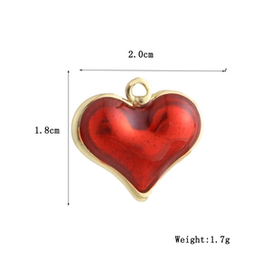 Macro view of 18k gold plated red heart pendant with size and weight measurements