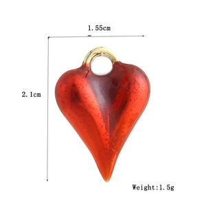 Detailed view of red heart pendant with dimensions 1.55cm by 2.1cm and 1.5g weight