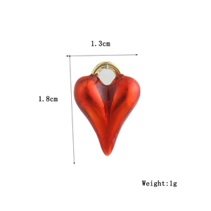 Detail showing red heart pendant dimensions 1.8cm by 1.3cm and 1g weight