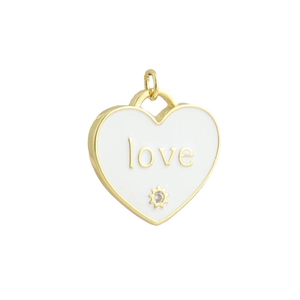 Detail of a white enamel heart pendant with gold LOVE text and a sparkling zircon stone