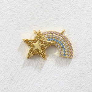 Detail of star and rainbow charm with colorful stones and gold-plated double-ring connector