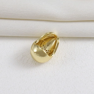 Macro shot of 18k gold-plated geometric hippo pendant with a high-polished surface