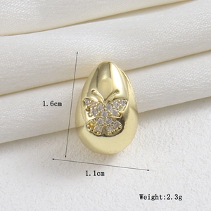Detailed view of 18k gold butterfly pendant with white zircon and size dimensions