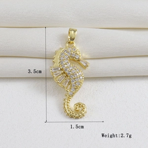 Macro shot of a 18k gold plated seahorse pendant with dimensions 3.5cm by 1.5cm