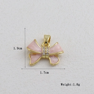 Detailed view of pink enamel bow pendant with zircon stones and dimensions 1.9x1.7cm