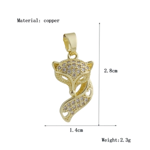 Detailed view of fox pendant in gold copper with zircon inlay and dimensions