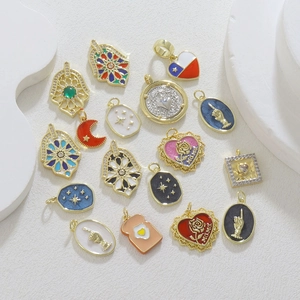 Detailed collection of gold-plated charms with colorful enamel and zircon accents