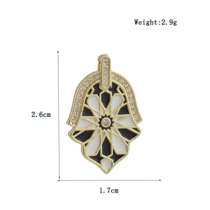 Detailed Hamsa charm with star pattern and zircon inlay measuring 2.6cm by 1.7cm