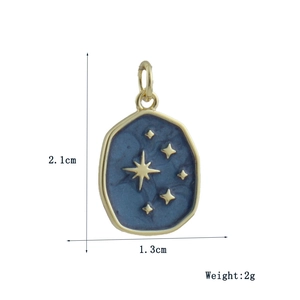 Detail of blue marble oval pendant with gold star pattern and 2.1cm x 1.3cm dimensions