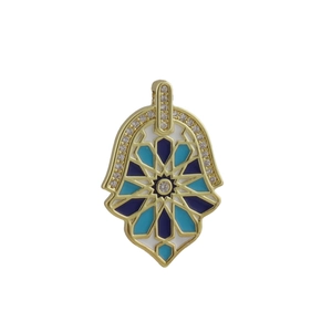 Detailed close-up of golden Hamsa Hand pendant with blue enamel star and white zircons
