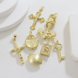 Detailed set of gold plated cross, anchor, and locket charms for DIY jewelry making