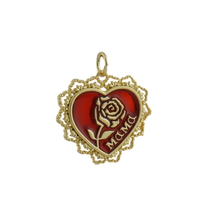 Detail of a vintage heart pendant with red enamel, gold rose relief, and MAMA inscription