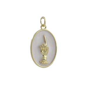 Detail of a vintage gold oval pendant featuring a hand gesture relief on enamel background