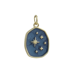 Macro detail of blue enamel star charm with gold plating for custom jewelry making