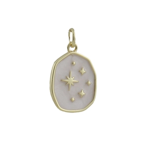 Macro view of a gold-plated oval star pendant with pink enamel and engraved star motifs