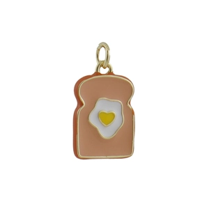 Detailed shot of bread toast pendant with heart egg yolk and gold-plated metal ring