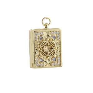 Detail of a golden book-shaped pendant featuring embossed floral patterns and small CZ stones