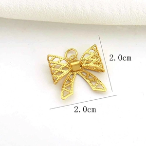 Detailed view of a 2.0cm gold hollow butterfly pendant for DIY jewelry making