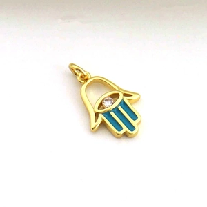 Macro shot of Hamsa Hand pendant with light blue enamel and sparkling white zircon stone