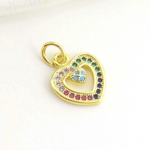 Detailed view of 18k gold plated hollow heart pendant with rainbow stones and turquoise
