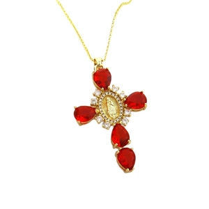 Elegant gold cross necklace with pear-shaped red zircons and Mary medal detail