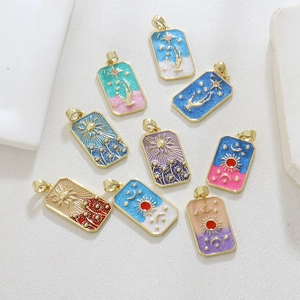 Macro shot of tarot pendants with gold plating and colorful enamel sun moon designs