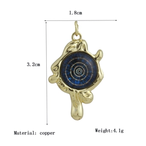 Detail view of 18K gold plated copper evil eye pendant with 3.2cm height and blue inlay