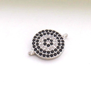 Détail du connecteur de bijoux œil maléfique avec pierres noires et claires dorées 18K