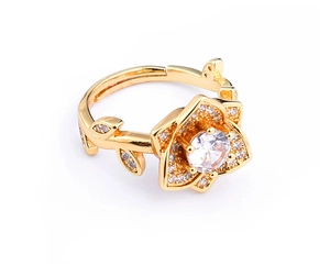 Detail of gold-plated flower ring with a large zircon center and micro-pave petals