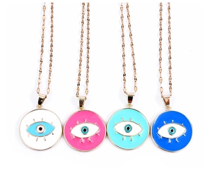 Detail of evil eye enamel pendants in white, pink, light blue, and dark blue on gold chains