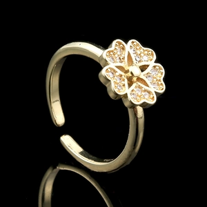 Gold-plated adjustable open ring featuring a four-leaf clover design with sparkling zircon