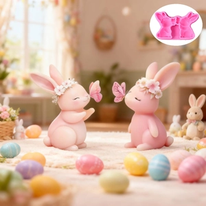 Close-up of pink flexible silicone mold showing double butterfly rabbit cavities for DIY crafts