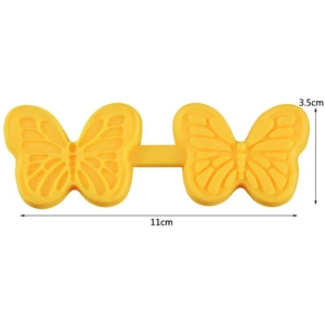 Detail of yellow silicone butterfly mold with dimensions 11cm and 3.5cm shown