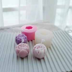 Macro shot showing 3D Austin peony and rose silicone molds for candle making