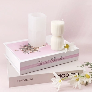 Vertical striped pillar silicone mold for DIY candles on white decorative books