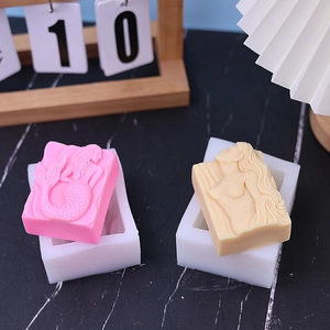 Detailed view of mermaid relief silicone molds and finished scented candle bars