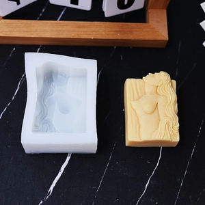 Silicone mold for DIY mermaid relief scented candles and soap on marble surface