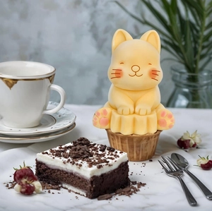 Cartoon kitten night light made of matte silicone on a cupcake base for home decor