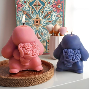 Cute bunny silicone mold DIY candles with flower design in pink and purple colors