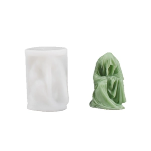 Silicone mold for DIY ghost monk candles and statues showing white mold and green figure