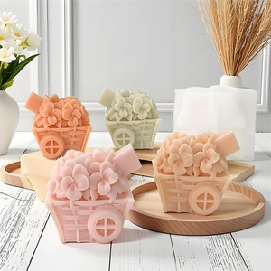 Flower basket silicone mold with finished floral scented candles on wooden tray