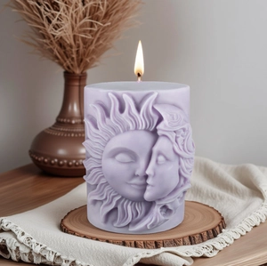 Lavender pillar candle with sun and moon goddess relief face on a rustic wooden base