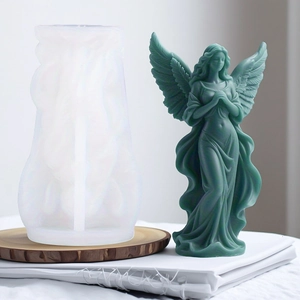 Detail of angel-shaped silicone mold showing intricate wing patterns and DIY finished candle