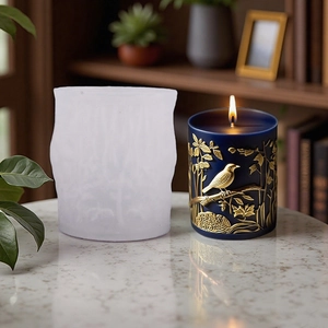 Silicone mold for DIY pillar candles featuring embossed bird and floral patterns