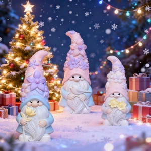 Three cute gnome figurines with flower and bird details for Christmas home decoration