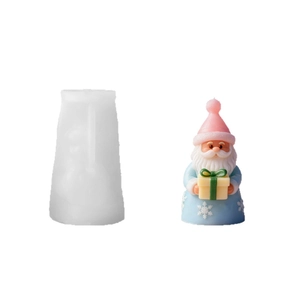 Santa Claus silicone mold with a finished pink hat candle figure and gift box decor