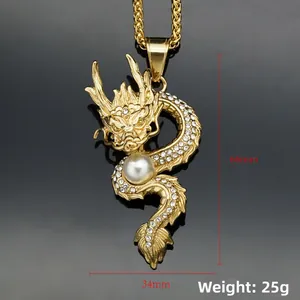 Detailed close-up of 18K gold-plated dragon pendant with white pearl and sparkling crystals