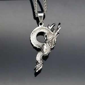 Intricate stainless steel dragon pendant necklace with polished silver finish and link chain